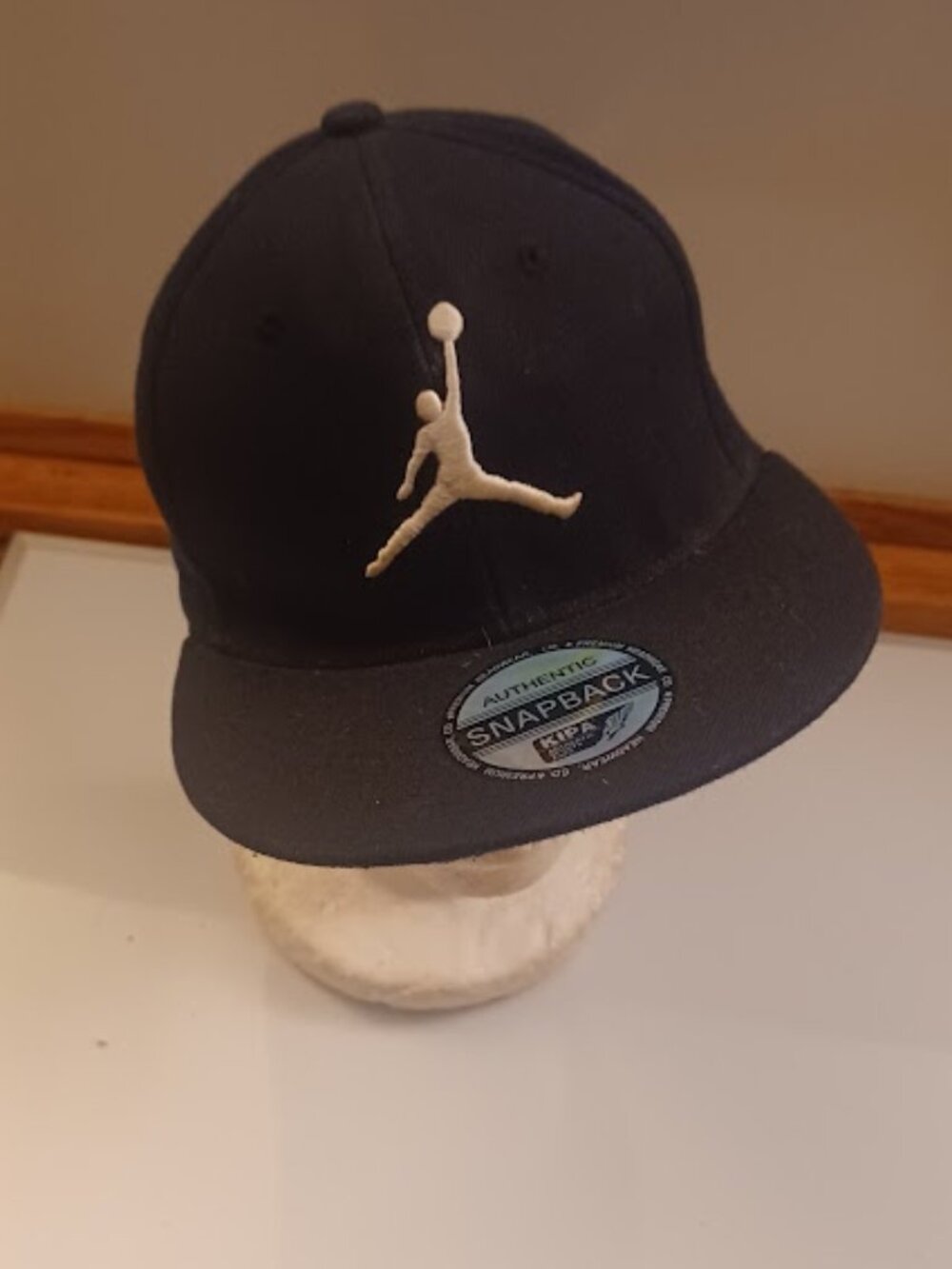 Jordan Men's Pro Jumpman Snapback Hat in black with a white embroidered logo
